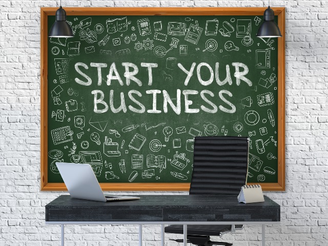Hand Drawn Start Your Business on Office Chalkboard.